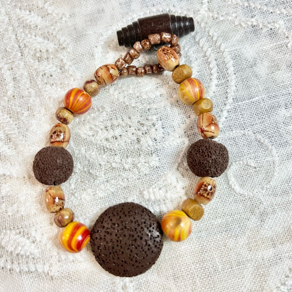 8 ⅓” Boho bracelet. Fun summer colors & style in lava, glass, wood